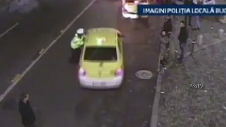CURSĂ NEBUNĂ în Capitală. Poliţist târât în trafic de un şofer care voia să scape de amendă VIDEO
