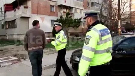 Fiul unui fost lider PNL, încătuşat pe stradă de poliţişti VIDEO