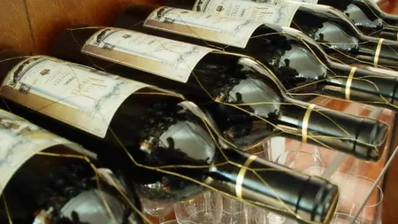 Sechestru pe 8.000 de sticle de vin ce aparţin unui avocat acuzat de evaziune fiscală cu un prejudiciu de 3 milioane euro