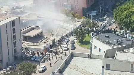 O macara s-a prăbuşit peste o clădire, la Tel Aviv. Sunt zeci de răniţi şi dispăruţi FOTO