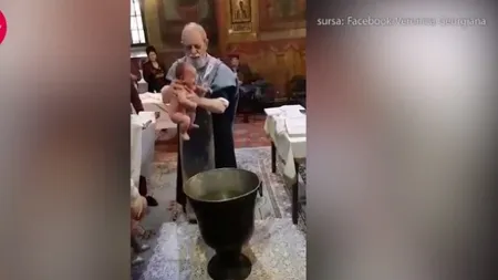 Anchetă după ce un preot a fost filmat bruscând un copil în timpul slujbei de botez