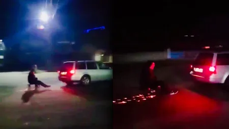 Distracţie periculoasă în Vâlcea. Un tânăr se plimbă cu sania trasă de maşină pe asfalt VIDEO