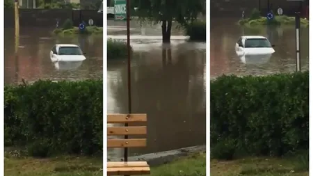 Femeie rămasă cu maşina blocată în mijlocul unei viituri şi străzi inundate din cauza ploilor torenţiale în Constanţa