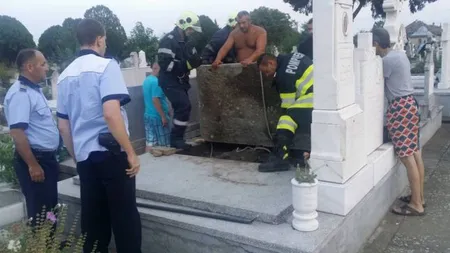 Câine îngropat de viu într-un cavou, scos după două zile de pompieri