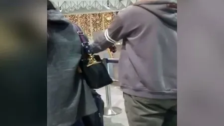 Furt filmat în direct, pe aeroport. Un român a prins un hoţ care jefuise o femeie VIDEO