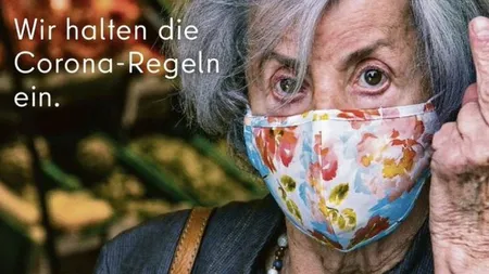 Coronavirus. Controverse la Berlin, după o reclamă în care o bătrână le arată degetul mijlociu celor care nu poartă mască FOTO
