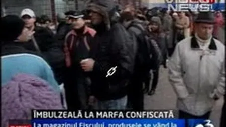 Coada de zeci de metri la deschiderea primului magazin de bunuri confiscate din Capitala. FOTO