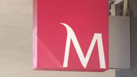 Millennium Bank si-a redus pierderile in primele sase luni