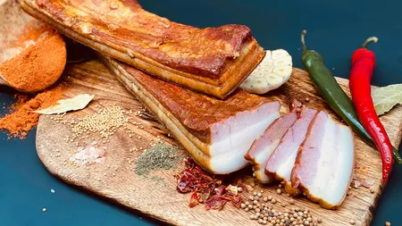 Preparatele pe care oamenii le consumă în cea mai fericită țară din lume. Slănina, carnea și untura sunt în top