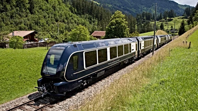 Elvețienii au făcut-o și pe asta: Trenul care trece de pe un ecartament pe altul și își ridică înălțimea vagoanelor! Totul, în câteva secunde!