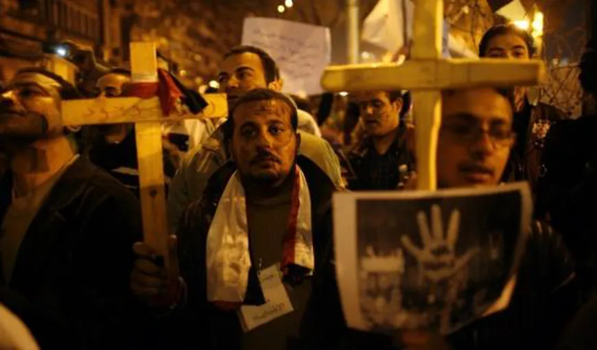 Trei morţi şi 12 răniţi în urma unor focuri de armă în faţa unei biserici din Cairo