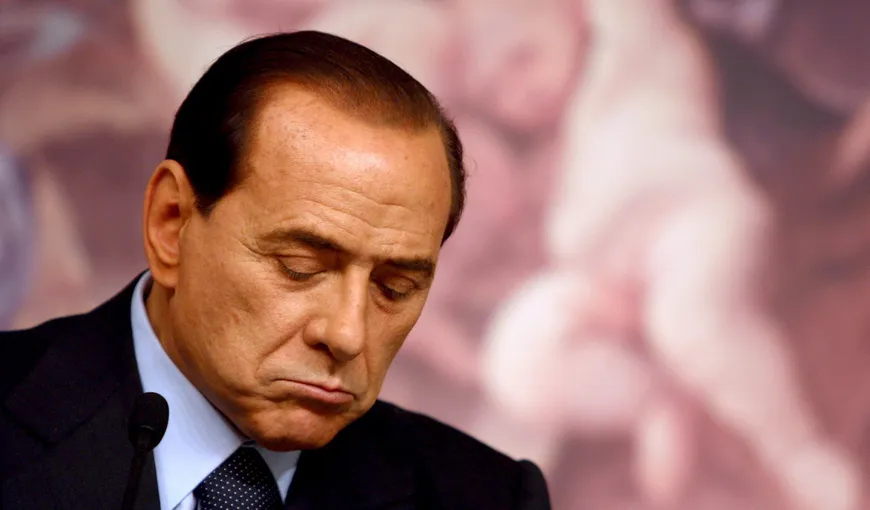 Berlusconi, huiduit de zeci de manifestanţi