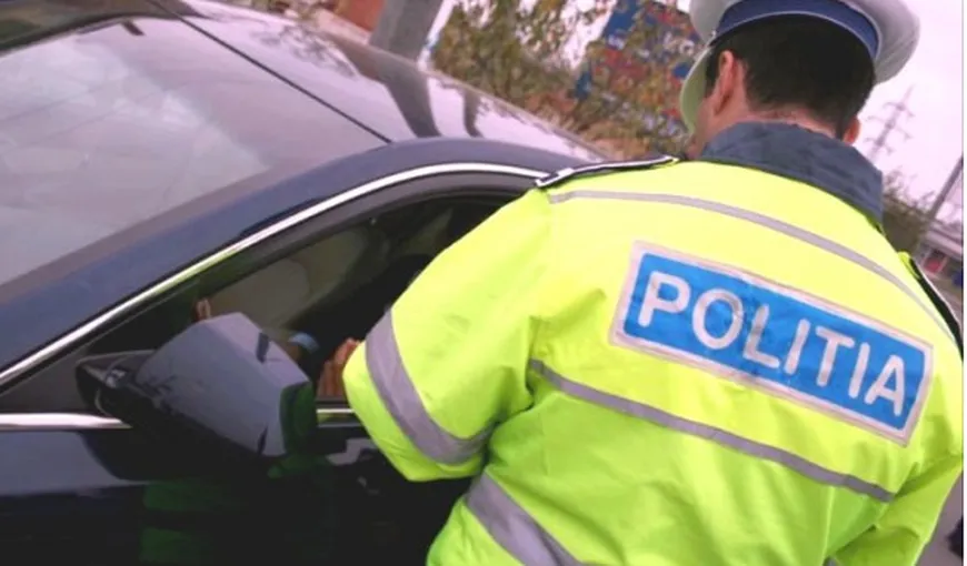 Poliţist muşcat de mână de soţia unui şofer pe care l-a oprit în trafic