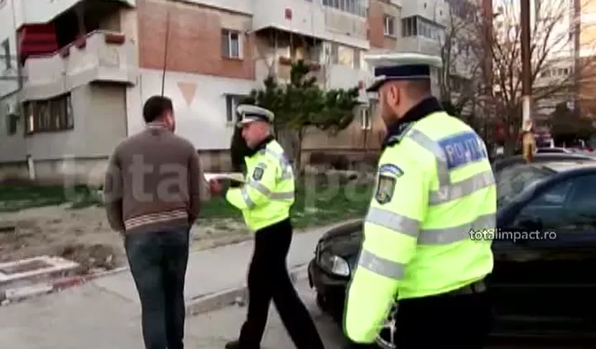 Fiul unui fost lider PNL, încătuşat pe stradă de poliţişti VIDEO