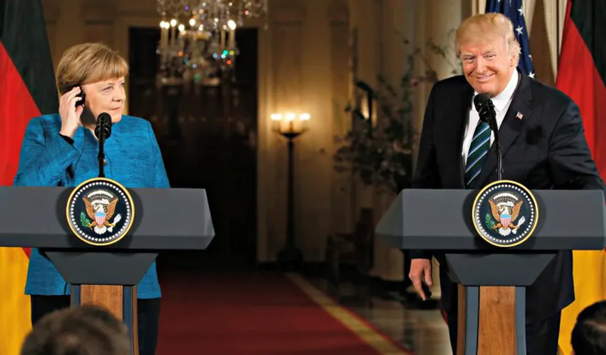 Donald Trump a spus voalat că el şi Merkel ar fi fost interceptaţi de servicii secrete
