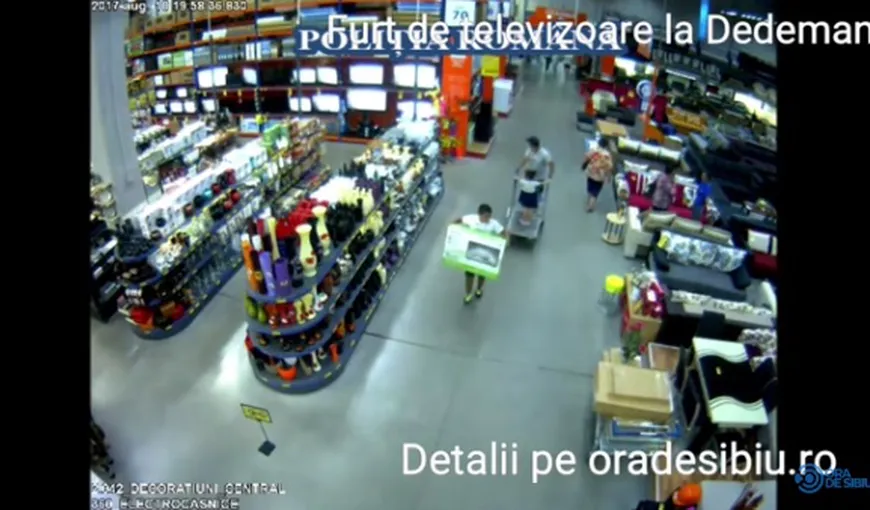Hoţi, filmaţi în timp ce furau mai multe televizoare dintr-un magazin din Sibiu VIDEO
