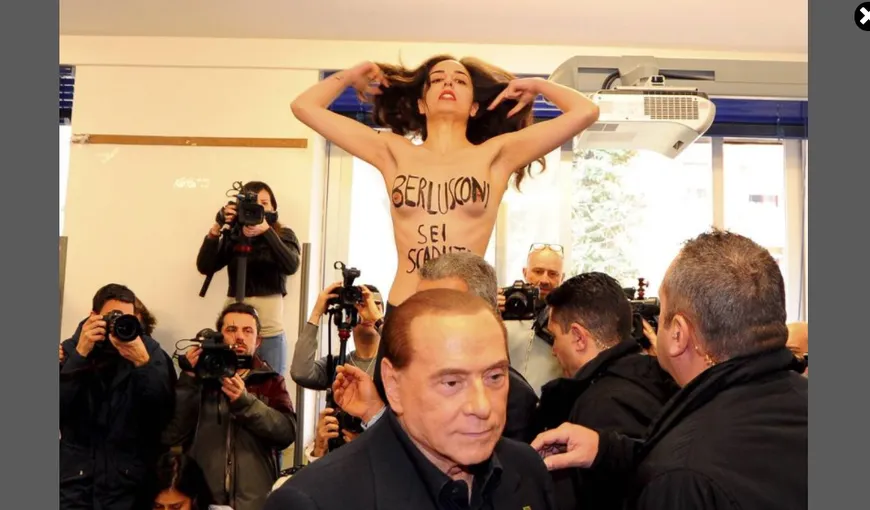 Alegeri în Italia. O femeie a protestat topless faţă de Berlusconi, numindu-l „expirat”