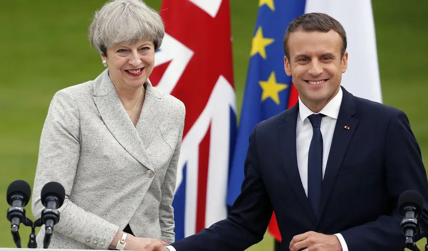 Emmanuel Macron şi Theresa May vor să consolideze interdicţia armamentului chimic