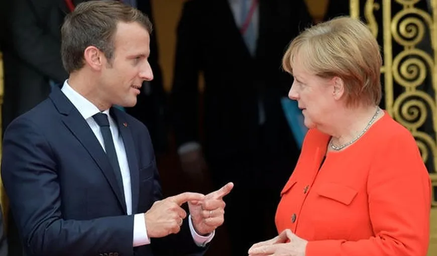 Macron şi Merkel cer acorduri între mai multe ţări privind migraţia