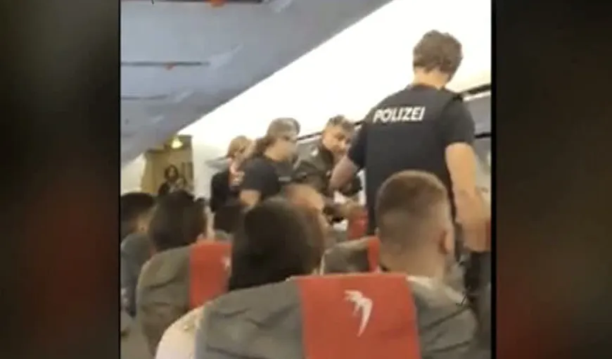 Român reţinut la bordul unui avion după ce a bătut o stewardesă. Momente de panică într-un avion aterizat de urgenţă la Viena – VIDEO