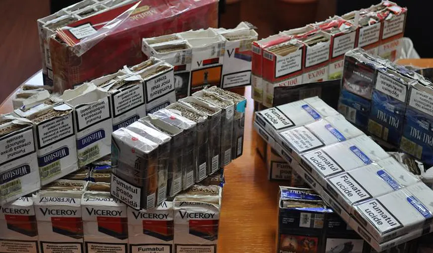 Zeci de mii de pachete cu ţigări de contrabandă găsite de poliţişti, ascunşi în carcasa unei autoutilitare