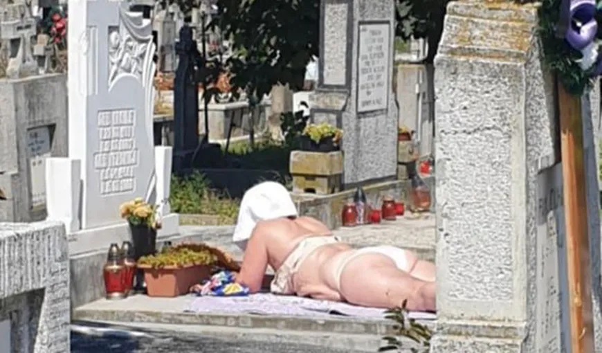 Incredibil. O femeie din Alba Iulia a făcut plajă în cimitir, pe o piatră de mormânt